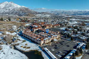 Snowy aerial view featuring a mountain view