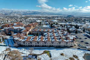 Snowy aerial view featuring a mountain view