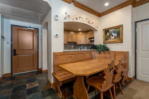 Dining area featuring ornamental molding