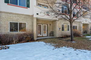 View of snow covered property entrance