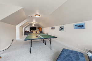 Playroom featuring carpet flooring and lofted ceiling