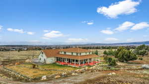 Aerial view featuring a mountain view and a rural view