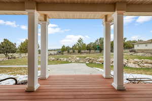 Wooden terrace with a patio area