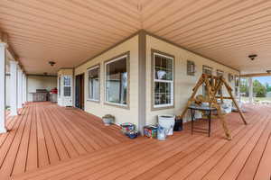 Deck with a porch and grilling area