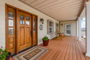 Property entrance featuring covered porch