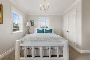 Bedroom featuring carpet flooring, a closet, and ornamental molding