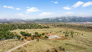 Drone / aerial view with a mountain view and a rural view