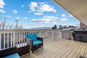 Deck featuring area for grilling and a mountain view