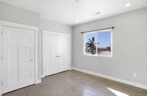 Unfurnished bedroom featuring a closet