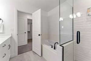 Bathroom with vanity and independent shower and bath