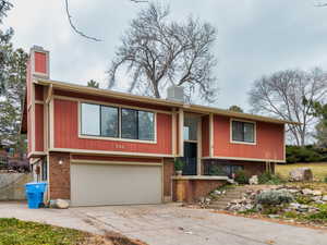 Bi-level home featuring a garage