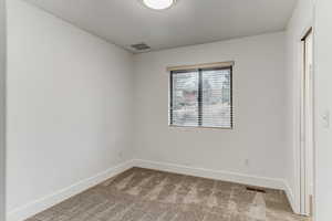 View of carpeted spare room