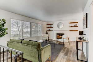 Living room featuring a fireplace and hardwood / wood-style floors