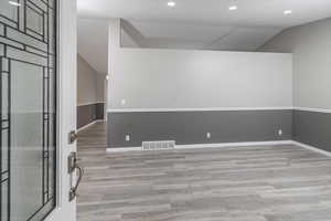 Spare room featuring light hardwood / wood-style flooring