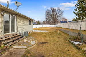 View of yard featuring central air condition unit