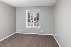 Unfurnished room with carpet floors