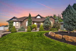 View of front of home with a yard