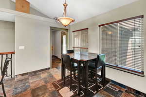 Dining room with vaulted ceiling