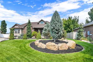 View of front of house with a front yard