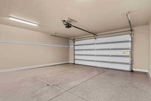 Garage featuring a garage door opener