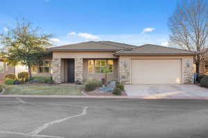 Prairie-style home featuring a garage