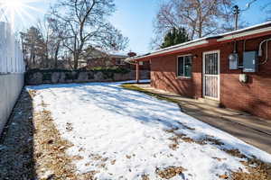 View of yard covered in snow