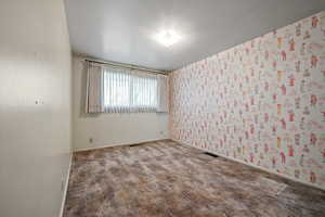 View of carpeted spare room