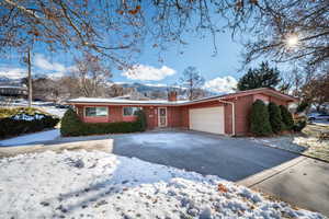 Single story home featuring a garage