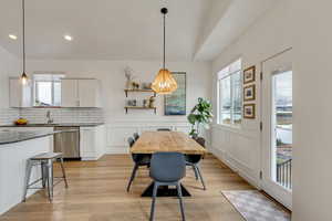 Dining room featuring light wood-type flooring and sink