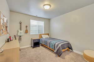 View of carpeted bedroom