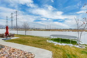 View of yard featuring a patio area and a trampoline