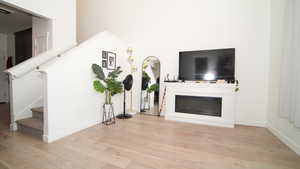 Living room with light hardwood / wood-style floors