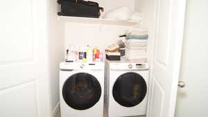 Clothes washing area featuring independent washer and dryer