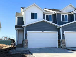 View of front of home featuring a garage