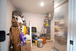 Utility room featuring secured water heater