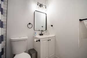 Bathroom featuring vanity and toilet