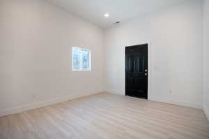 Unfurnished room with light hardwood / wood-style floors