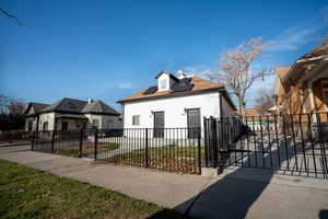 View of front of house featuring solar panels