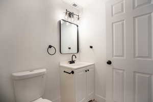 Bathroom with vanity and toilet