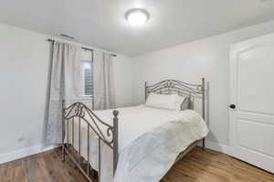 Bedroom featuring hardwood / wood-style flooring