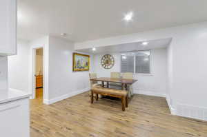 Dining space featuring light hardwood / wood-style flooring