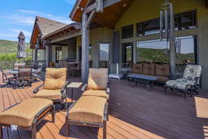 Wooden terrace featuring an outdoor living space