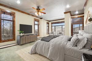 VIRTUALLY STAGED - Carpeted bedroom featuring ceiling fan, crown molding