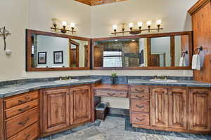 Bathroom featuring a shower and vanity