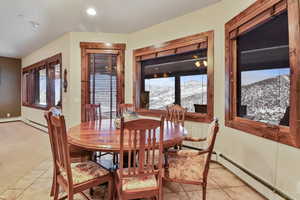 Tiled dining area featuring a mountain view