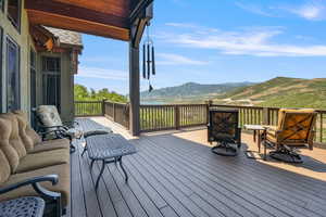 Wooden terrace featuring a mountain view