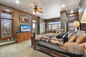 Carpeted bedroom with ceiling fan