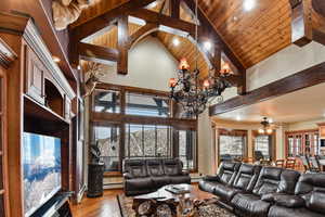 Living room featuring ceiling fan, wooden ceiling, high vaulted ceiling and hardwood / wood-style floors