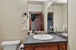 Bathroom featuring vanity and toilet