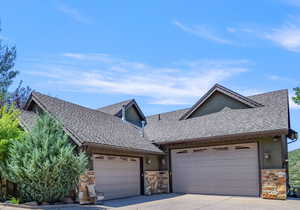 View of front facade featuring a garage